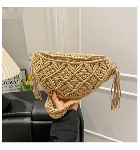 Close-up of bohemian macrame sling bag featuring intricate fringe and geometric patterns