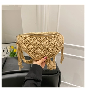 Detailed macro view of bohemian hand-woven macrame chest bag with fringe and zipper