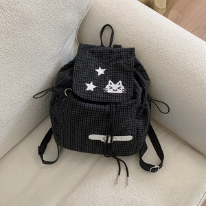 Detail of drawstring plaid backpack with cute cat embroidery and white star design