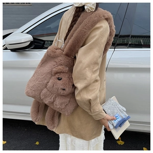 Detailed macro view of the fluffy brown rabbit shaped plush tote bag with embroidery