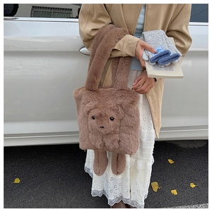 Detail of soft brown plush teddy bear tote bag with fluffy texture for autumn and winter