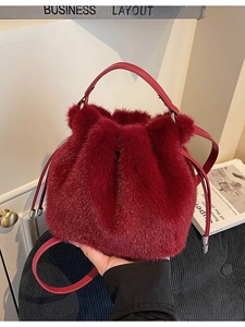 Burgundy faux fur bucket bag with drawstring closure and crossbody strap for autumn winter