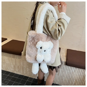 Detail of plush shoulder bag in pink and white with cute 3D dog mascot for women