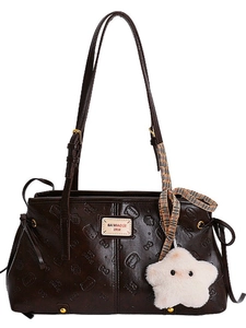 Brown oil wax leather tote bag with embossed cat patterns and a star plush charm