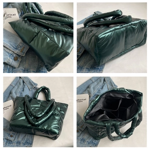 Detailweergave van de grote donkergroene gewatteerde shopper met binnenzakken en glans
