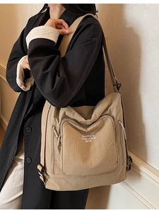Khaki canvas tote bag with large pocket and adjustable shoulder strap for women
