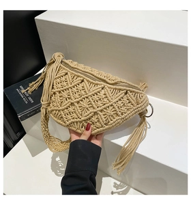 Close-up of beige crochet chest bag with hollow diamond pattern and fringe detail