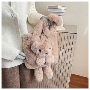 Detail shot of a plush teddy bear tote bag showing soft texture and 3D bear features