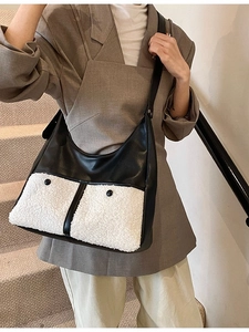 Minimalist black leather and white fleece tote bag with large front button pockets