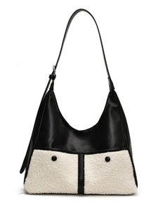Fuzzy vintage hobo bag in black and white faux fur with adjustable strap and large capacity