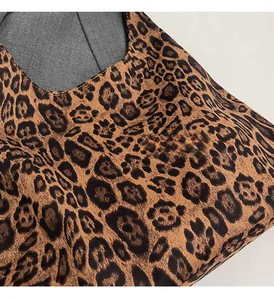 Close-up of leopard print faux suede fabric with soft texture and high-quality stitching