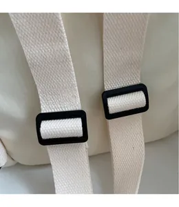 Detail of adjustable thickened woven shoulder straps with durable black plastic buckles