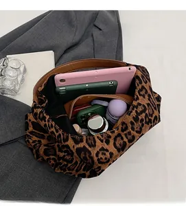 Close-up of leopard print shoulder bag interior showing large capacity for essentials