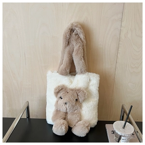 Detail of plush bear tote bag showing soft faux fur texture and 3D teddy bear design