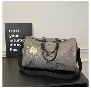 Detail of high-capacity graffiti travel bag with durable straps and colorful art prints