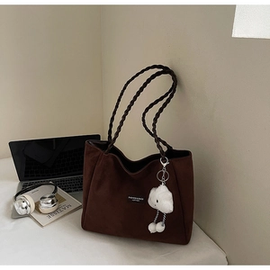 Brown suede tote bag with woven handles and a cute cloud charm for daily commute