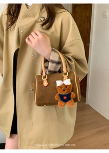 Brown frosted leather Boston handbag with khaki handles and a cute teddy bear charm
