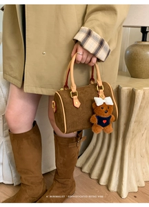 Caramel brown frosted suede Boston bag with a cute bear charm for fall and winter style
