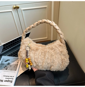 Detail of plush beige handbag featuring woven PU handle and colorful wooden bead tassel