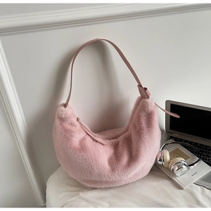 Detailed view of pink fuzzy plush crescent bag with premium zipper and leather shoulder strap