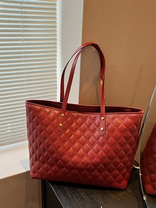 Quilted large capacity tote bag in wine red with gold rivets and slim shoulder straps