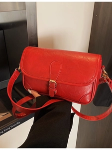 Retro bright red faux leather saddle bag with gold metal buckle and shoulder strap