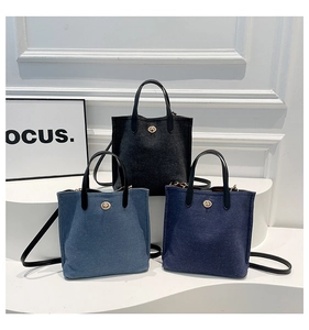 Detailed comparison of canvas bucket bags in grey, light blue, and dark blue denim