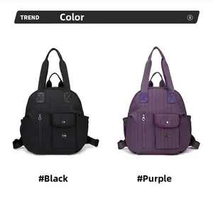 Front detail of black and purple quilted travel backpacks with vertical zipper pockets