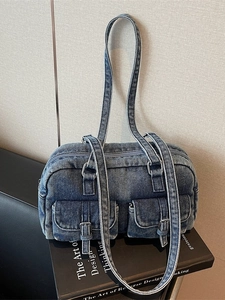 Vintage dark blue wash denim Boston shoulder bag with dual front pockets and contrast stitching