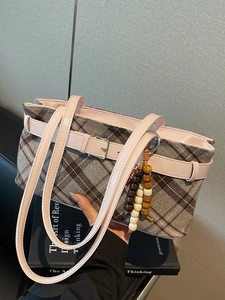Vintage plaid underarm bag with pink leather strap and decorative wood beads for daily commute