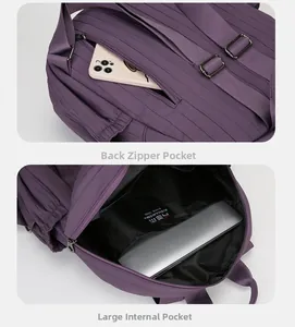 Detail of purple backpack showing anti-theft back pocket and large internal laptop sleeve