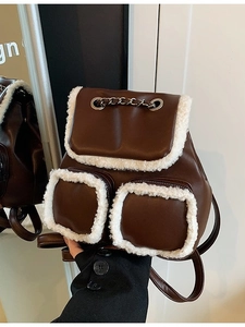 Vintage dark brown faux leather backpack with plush trim and metallic chain details