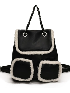 Vintage black leather backpack with white faux fur trim and silver chain handle