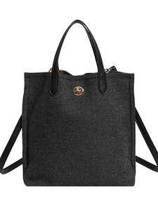 Large dark grey denim bucket tote bag with gold twist lock and black leather handles