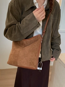 Brown vintage suede patchwork crossbody bucket bag with adjustable shoulder strap