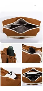 Detail view of large brown crossbody bag showing waterproof nylon and multiple pockets