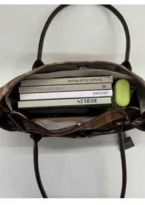 Top view of the checkered tote bag interior showing large capacity with books and umbrella