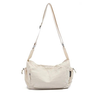 Detail view of adjustable shoulder strap and durable nylon texture on large travel bag