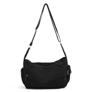 Black nylon shoulder bag with multiple pockets and adjustable strap for casual daily use