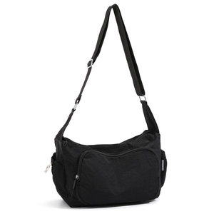 Detail view of the black lightweight nylon shoulder bag with adjustable strap and zip pocket
