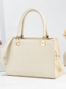 Elegant cream crocodile pattern handbag with braided handles and golden metal hardware