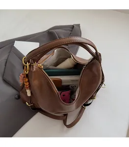 Interior view of large capacity dark brown tote bag showing spacious storage for essentials