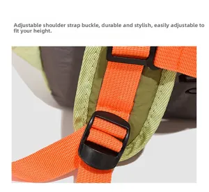 Detail of adjustable orange woven strap and durable buckle on green outdoor backpack