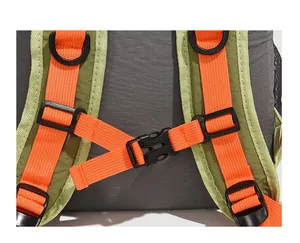 Close-up of durable orange buckle and D-ring on a grey outdoor hiking backpack