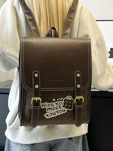 Vintage brown school backpack with leopard print and teddy bear embossed flap on model