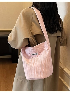 Minimalist light pink pleated shoulder bucket bag with LOVE label and wide strap