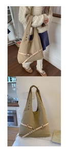 Detail view of khaki large tote bag featuring metal eyelets and decorative belt strap