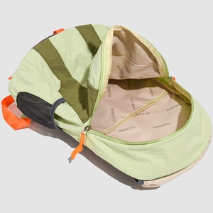 Top view of spacious contrast travel backpack interior with green color-block design