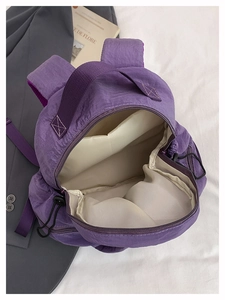 Detail view of large main compartment with inner lining and reinforced carry handle