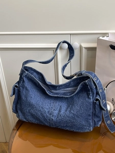 Retro washed dark blue denim shoulder bag with adjustable eyelet strap and side pocket